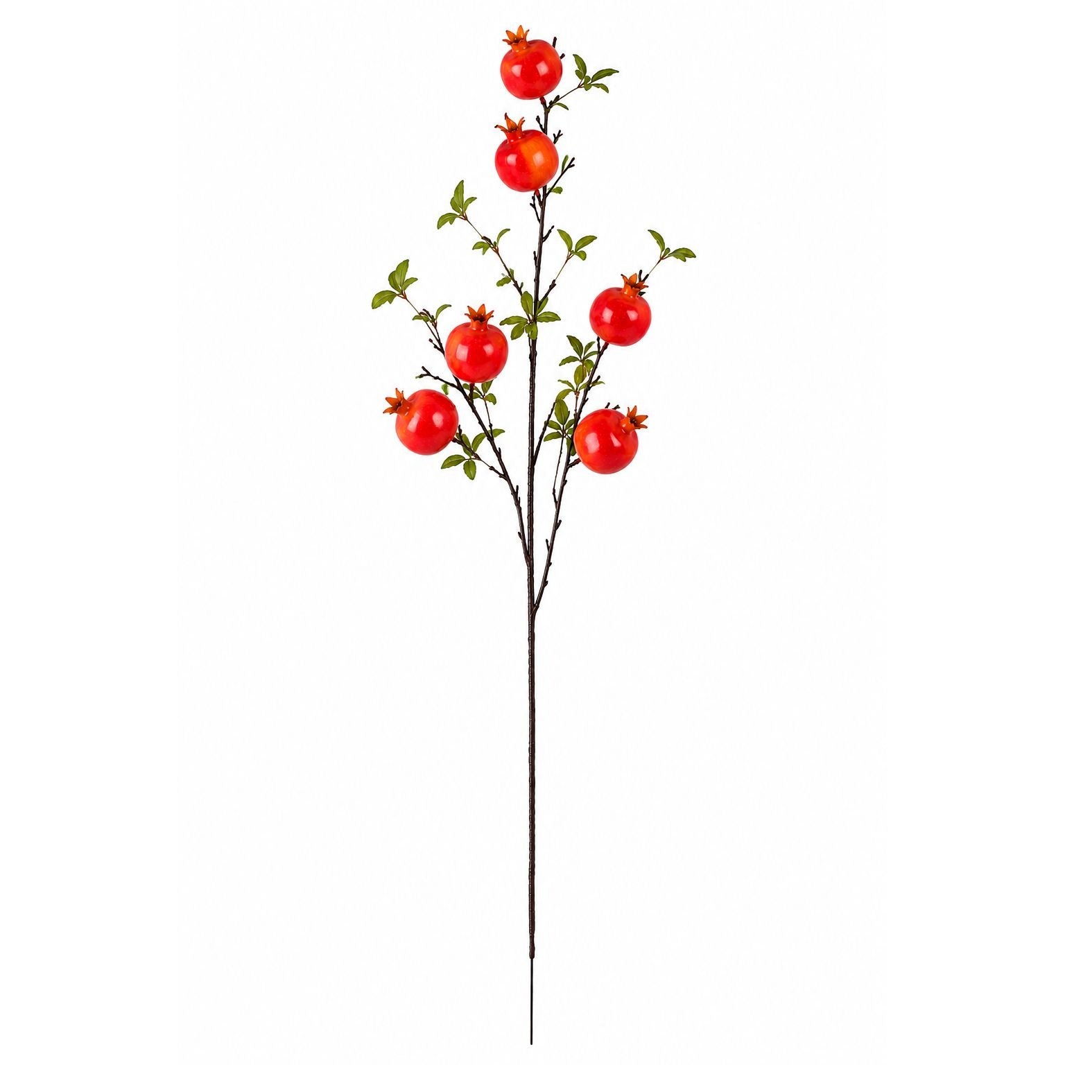 Artificial pomegranate branch with red fruits on a white background