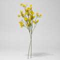 Yellow artificial flower branch on a white background