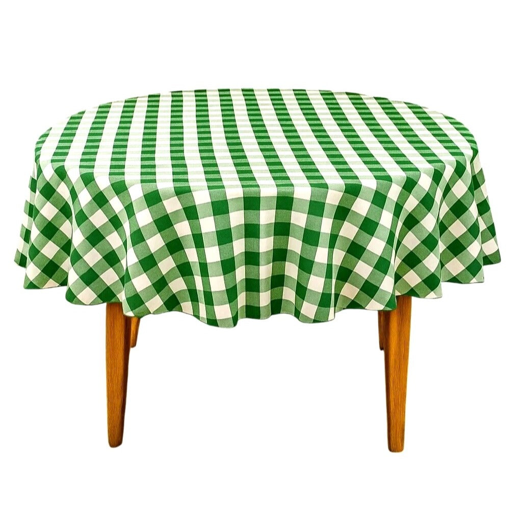 Green and white checkered tablecloth on a wooden table with a white background