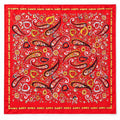 A square red satin scarf featuring an intricate paisley and floral pattern in yellow, white, black, and orange, finished with a decorative border.