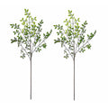 Two artificial green leafy branches on a white background