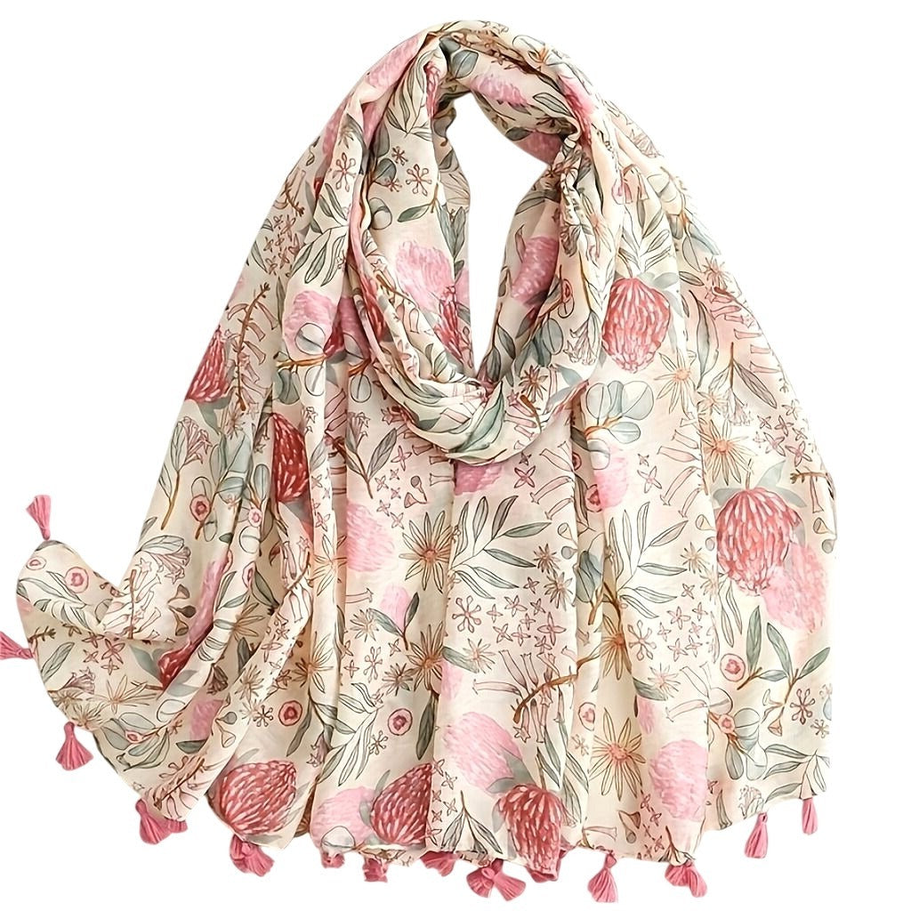 Floral patterned scarf with pink tassels on a white background