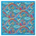 A square scarf with a vibrant blue border and an all-over paisley pattern in red, gold, white, and black on a bright blue background.