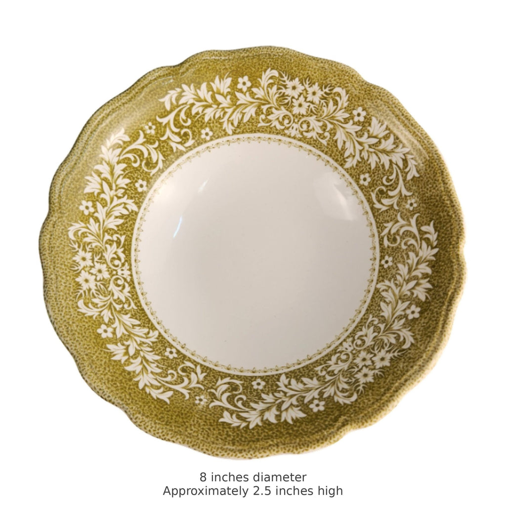 A round ceramic plate with a scalloped rim, featuring a textured olive green border with a white floral and scroll pattern around a smooth white center. Text below reads '8 inches diameter Approximately 2.