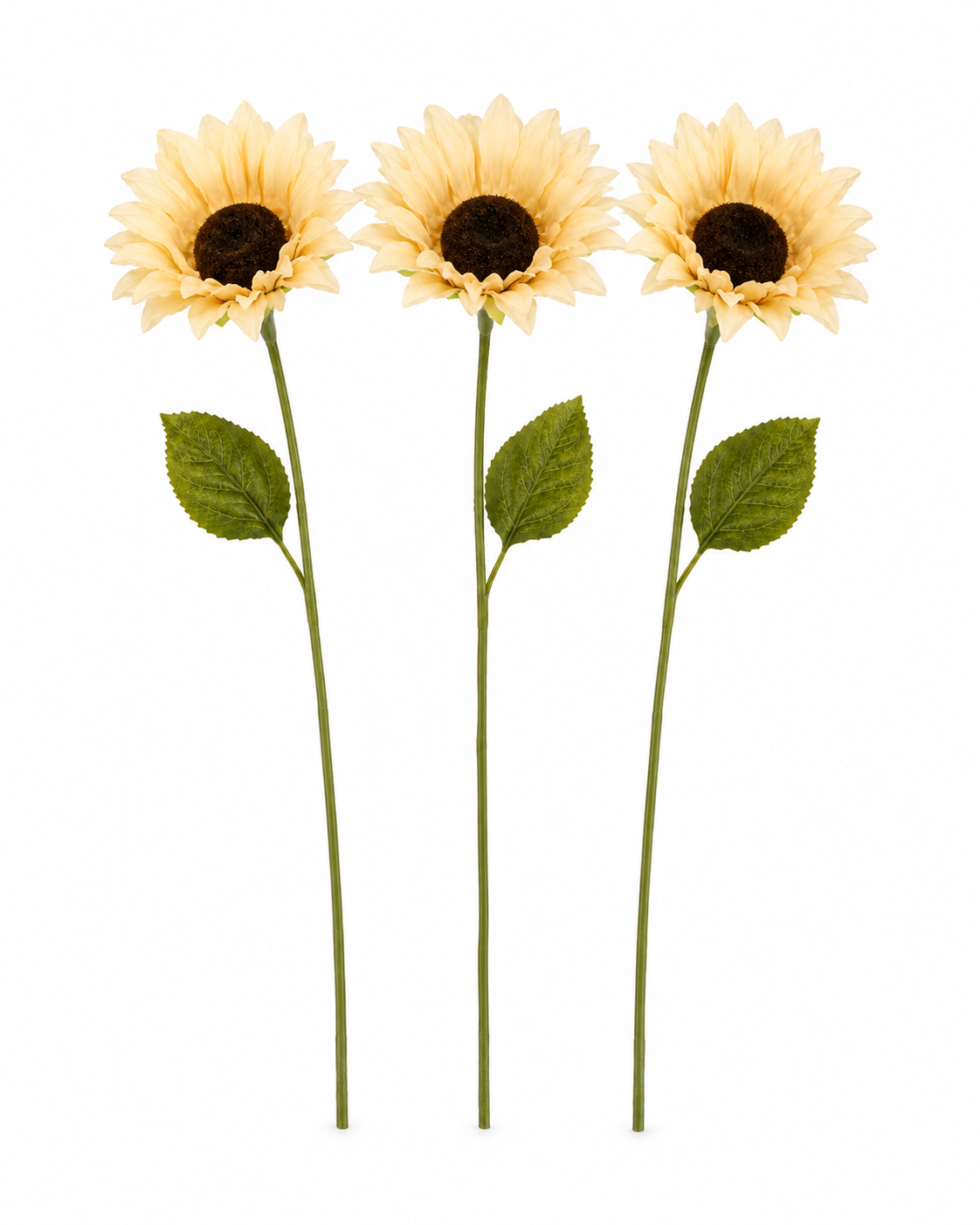 Three artificial sunflower stems with pale yellow petals, dark brown centers, and green leaves on a plain white background.