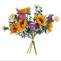 Bouquet of artificial flowers with sunflowers and other colorful blooms on a white background