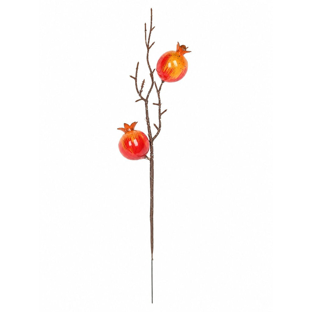 Decorative branch with red pomegranate ornaments on a white background
