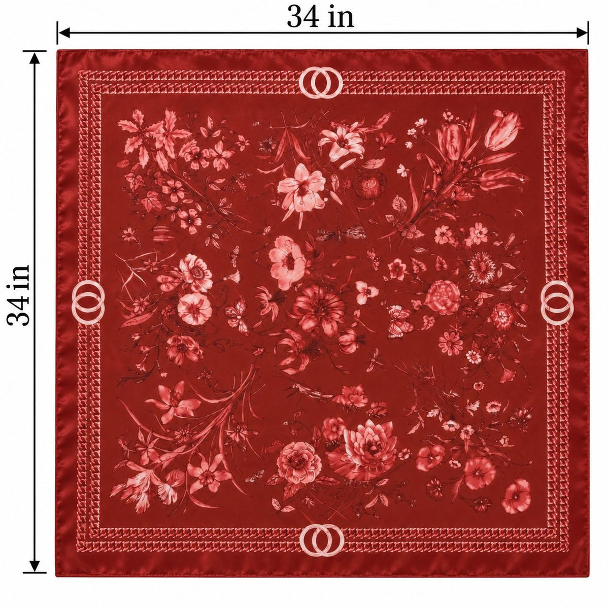 A square red floral scarf or bandana with a decorative border, shown with dimension lines indicating 34 inches on each side. The fabric features a dense floral pattern in shades of red, pink, and white, with small double-ring motifs at the corners and along the border.