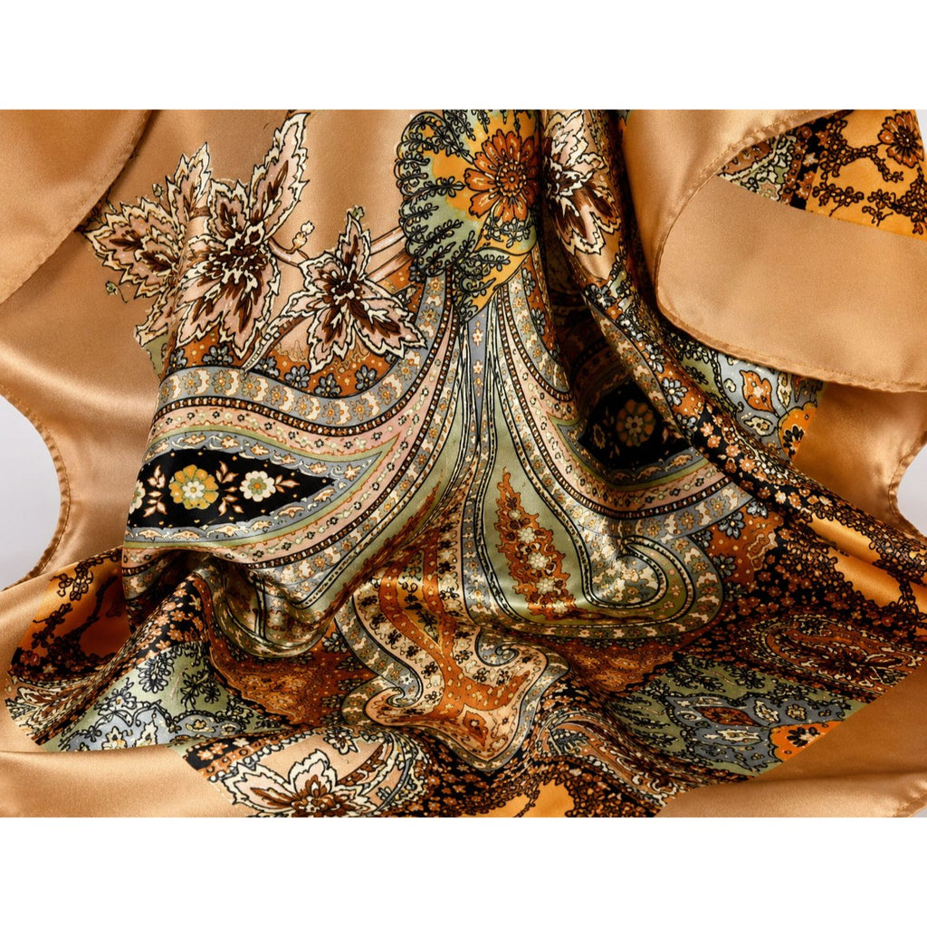 Close-up of a patterned fabric with intricate designs on a beige background