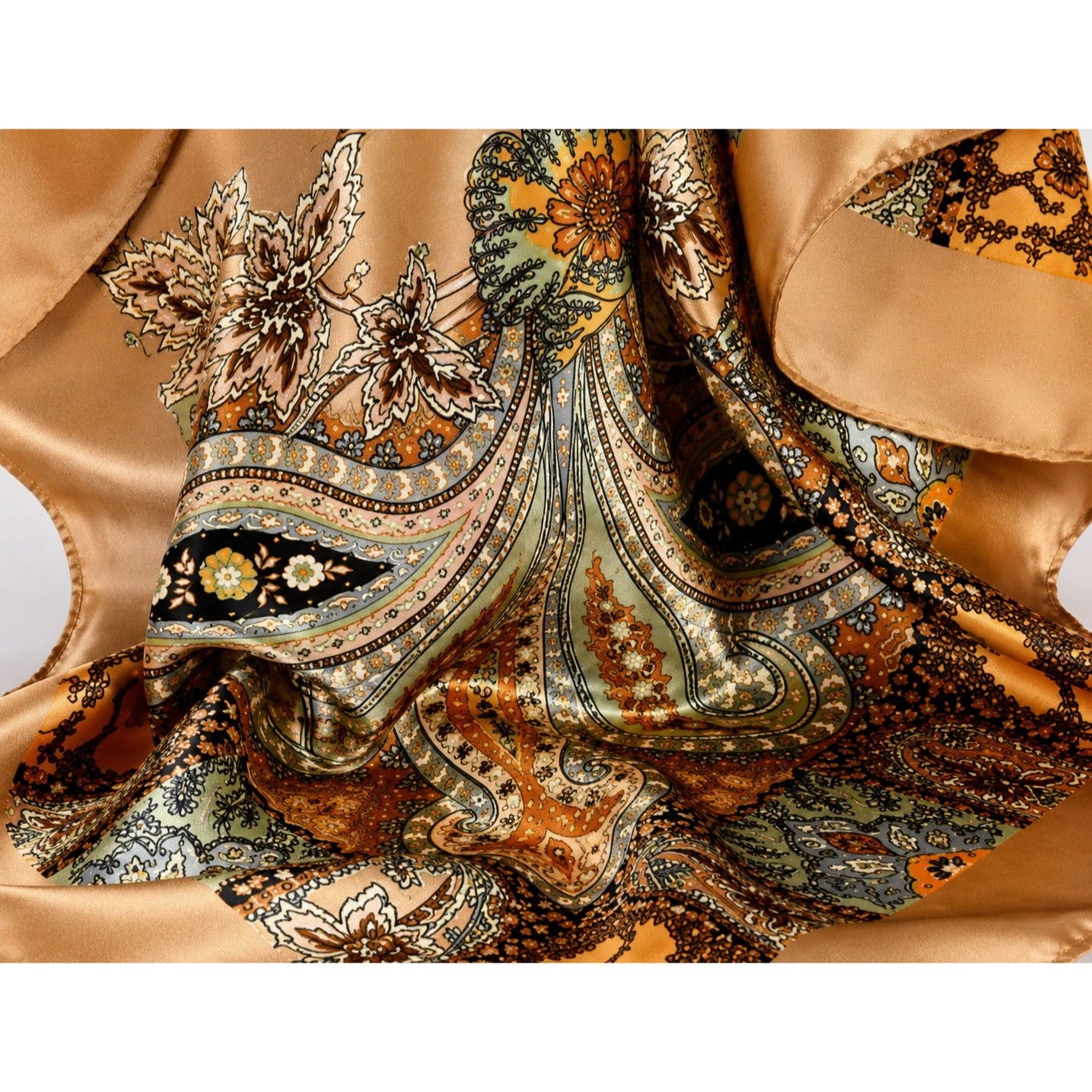 Close-up of a patterned fabric with intricate designs on a beige background
