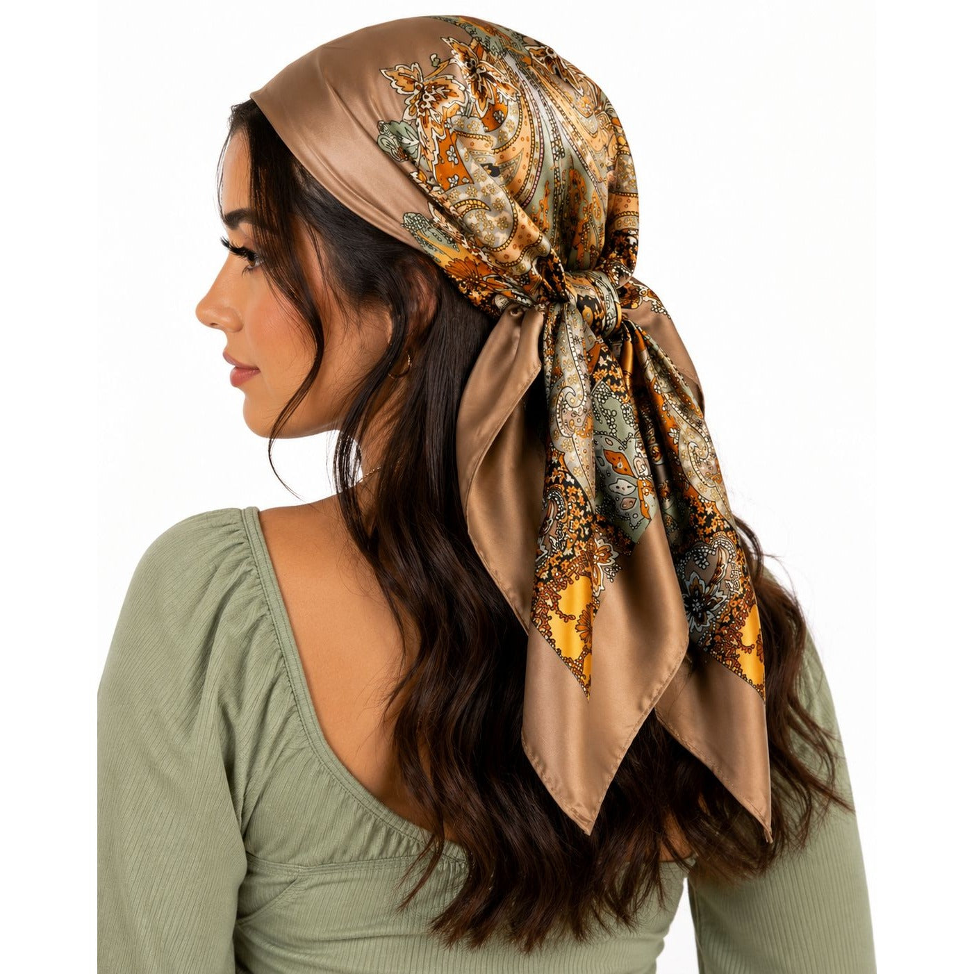Woman wearing a patterned headscarf on a white background
