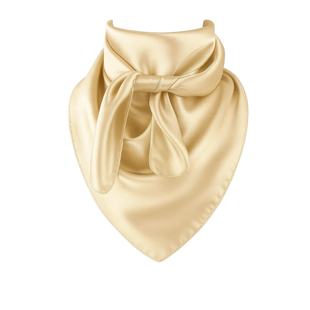 Beige silk scarf with a bow on a white background