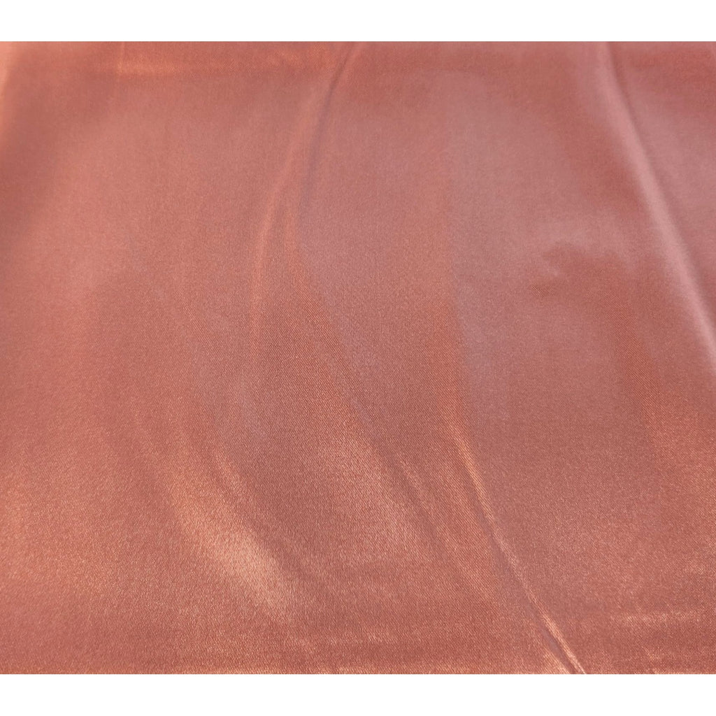 Close-up dusty rose satin wild rag scarf texture showing silk-like sheen and drape