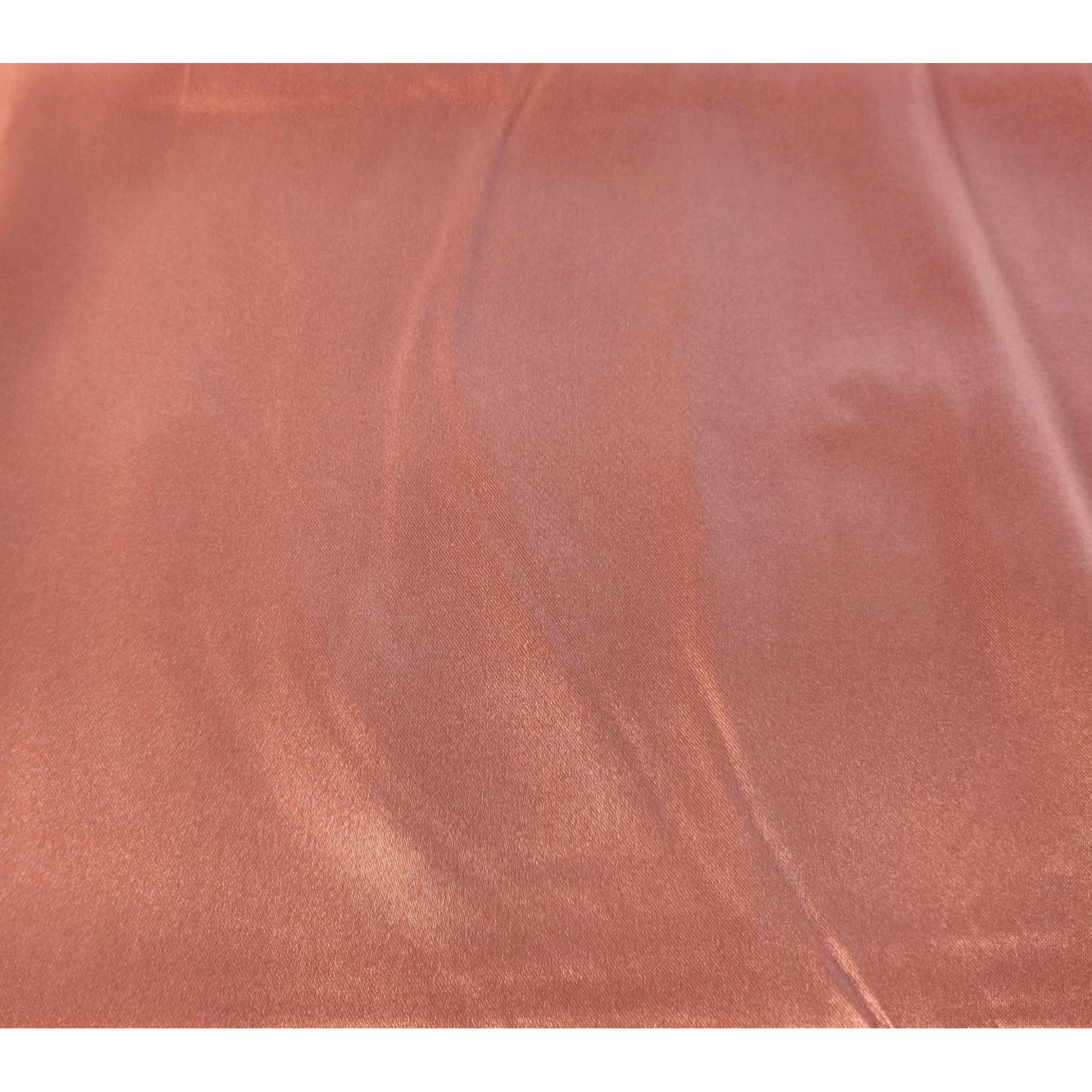 Close-up dusty rose satin wild rag scarf texture showing silk-like sheen and drape