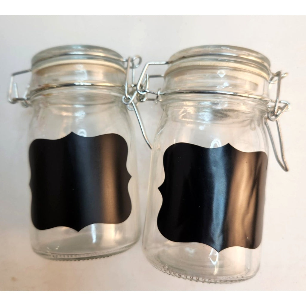 Glass jar with reusable chalkboard label and airtight metal clamp closure
