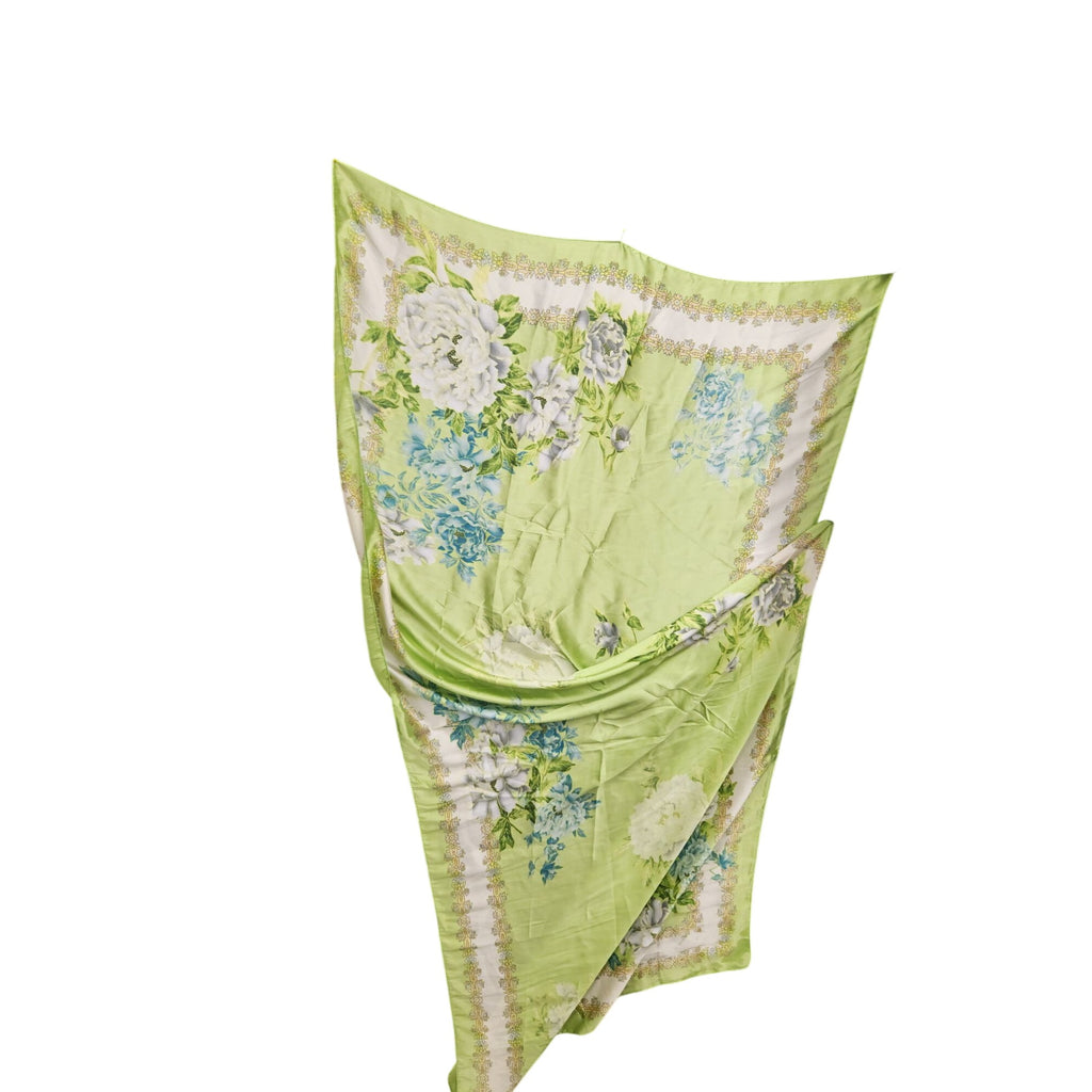 Green floral patterned scarf on a white background