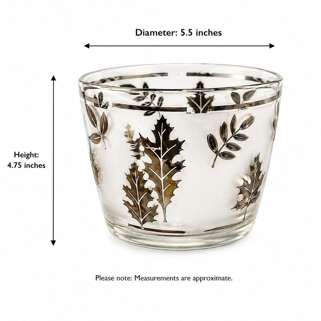 Glass container with leaf patterns and measurements on a white background