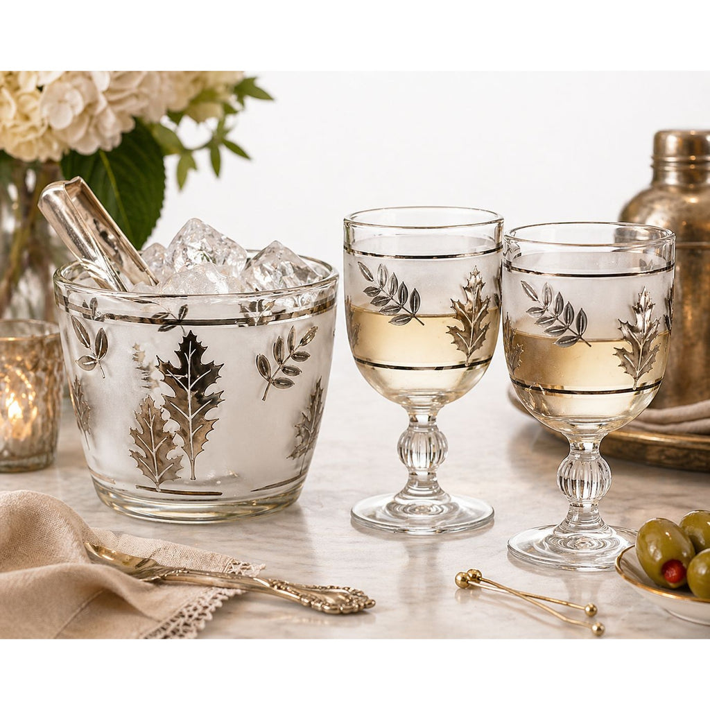 Decorative glassware with leaf patterns on a table setting.