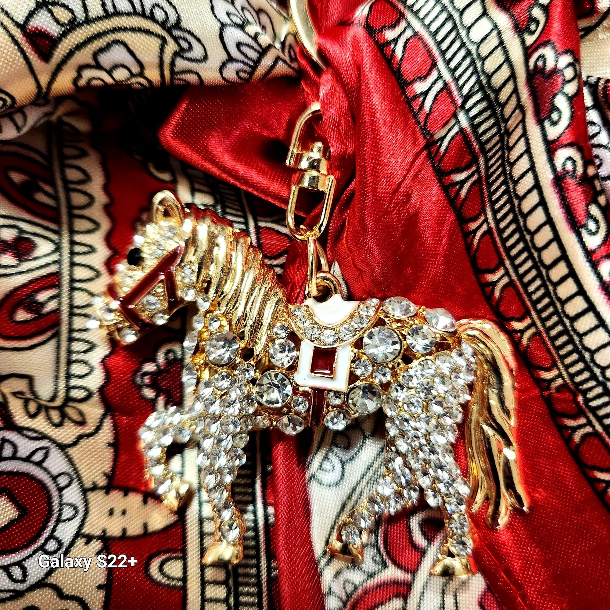 Equestrian keychain charm showing moveable tail feature
