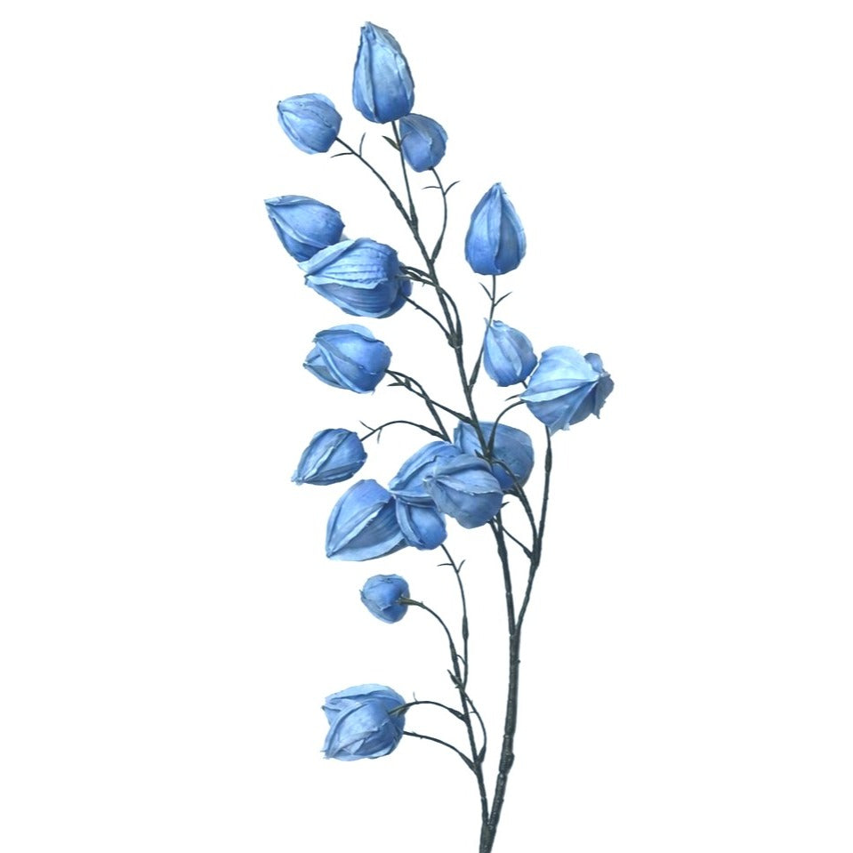 Artificial blue flower branch on a white background