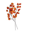Artificial orange flower branch on a white background