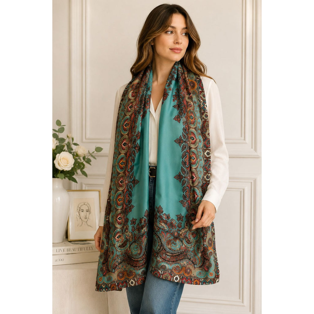 Woman wearing a patterned scarf in a room with decorative elements