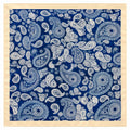 A square scarf with a detailed blue and white paisley pattern, finished with a solid beige border, shown flat against a white background.