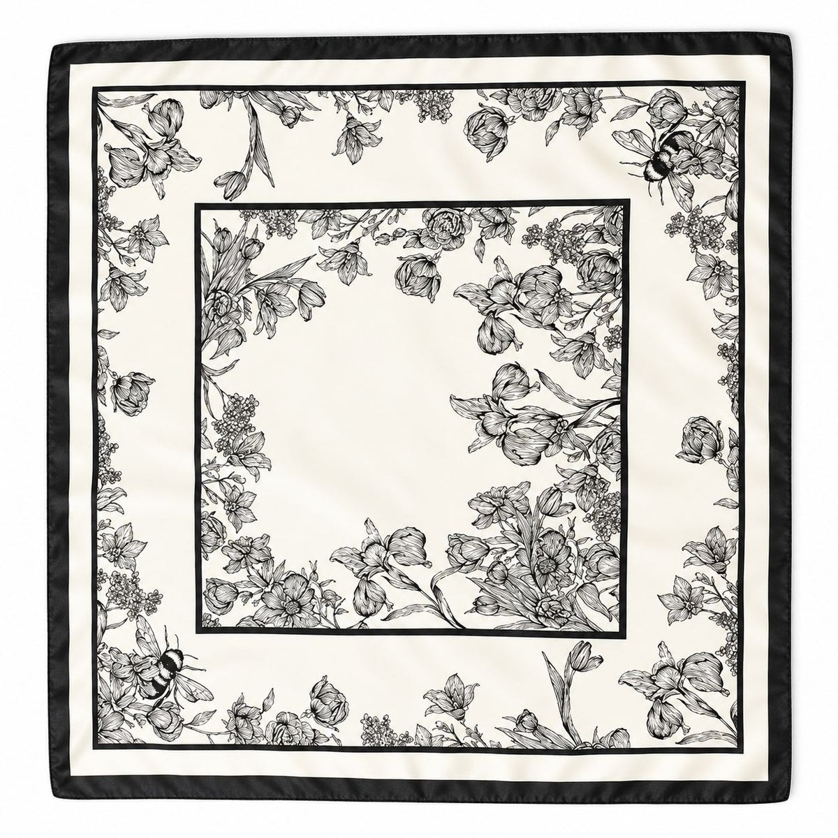 A square scarf with a black and white floral border pattern, featuring detailed line drawings of flowers, leaves, and bees, with a solid black outer border.