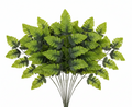 10 individual artificial fern stems with leather-look green leaves fanned out on white background