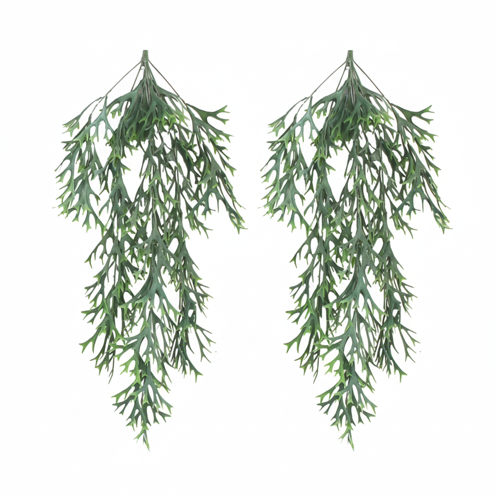 Two artificial cascading staghorn fern bunches hanging side by side on white background - faux trailing plant wall decor