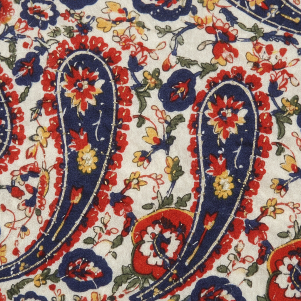 Close-up detail of cream ivory paisley floral satin scarf fabric showing intricate navy red and gold pattern with silky texture and subtle sheen