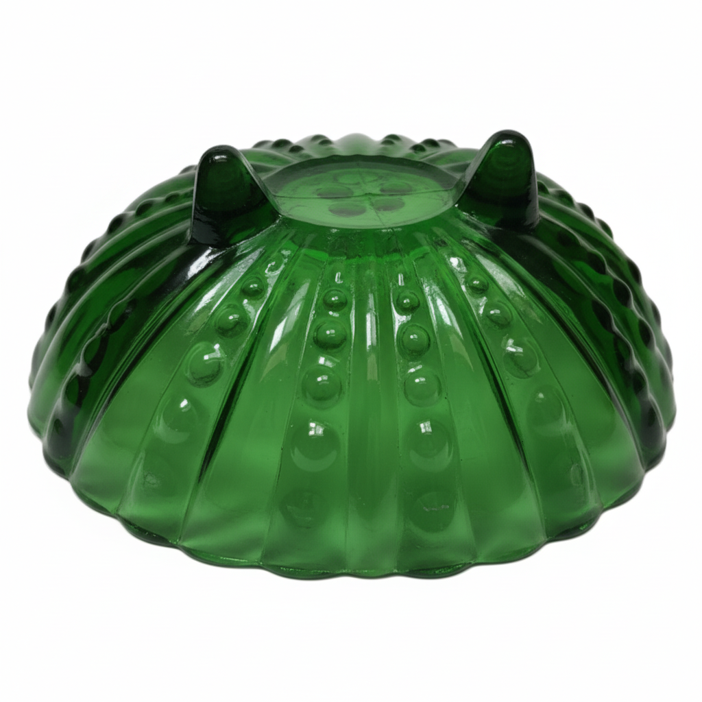 Bottom view of vintage Anchor Hocking green footed bowl showing three cone-shaped feet, 1950s Burple pattern emerald glass base detail