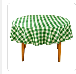 Green and white checkered tablecloth on a round table with wooden legs against a white background