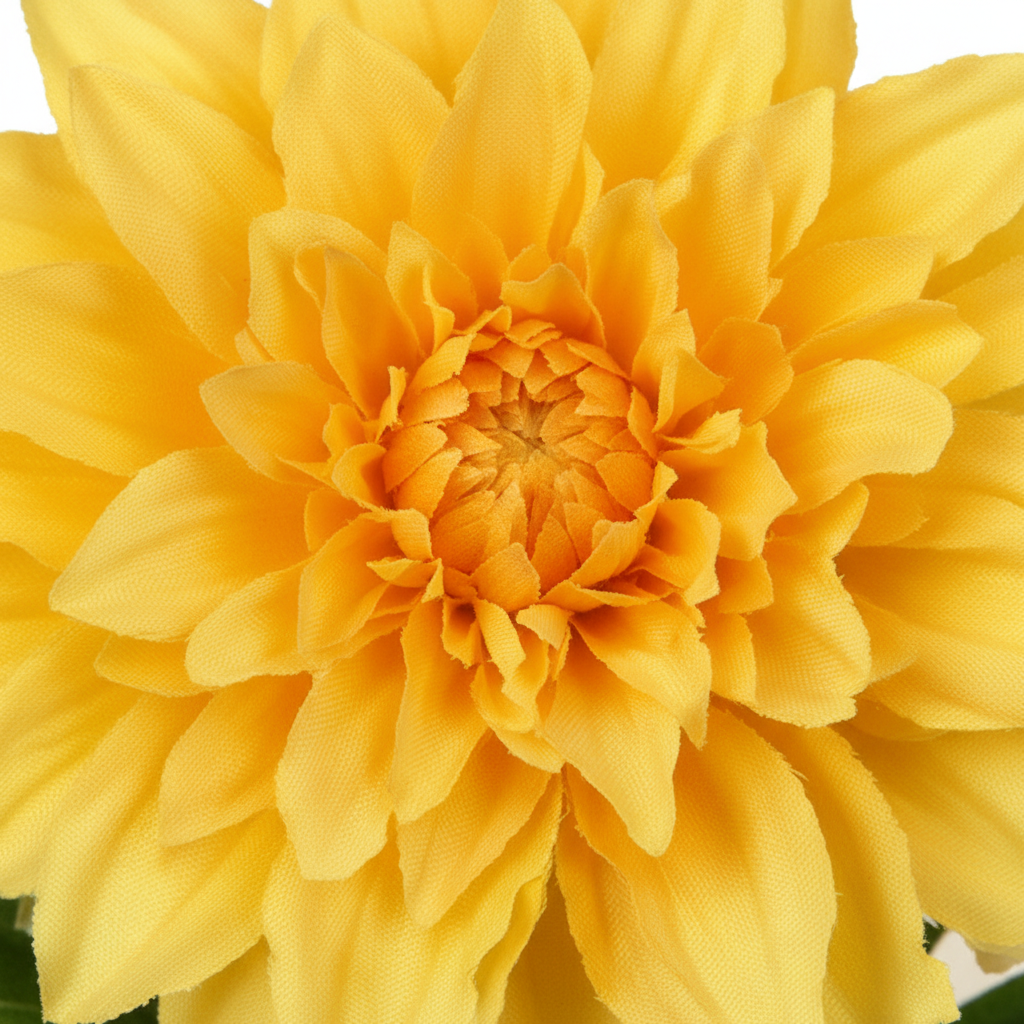 Close-up of yellow dahlia artificial flower bloom showing layered silk petals in golden yellow tones