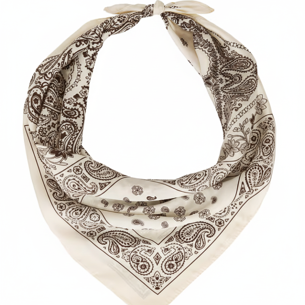 Cream and chocolate brown paisley bandana square scarf folded into a triangle and tied as a neck bandana showing satin sheen on white background