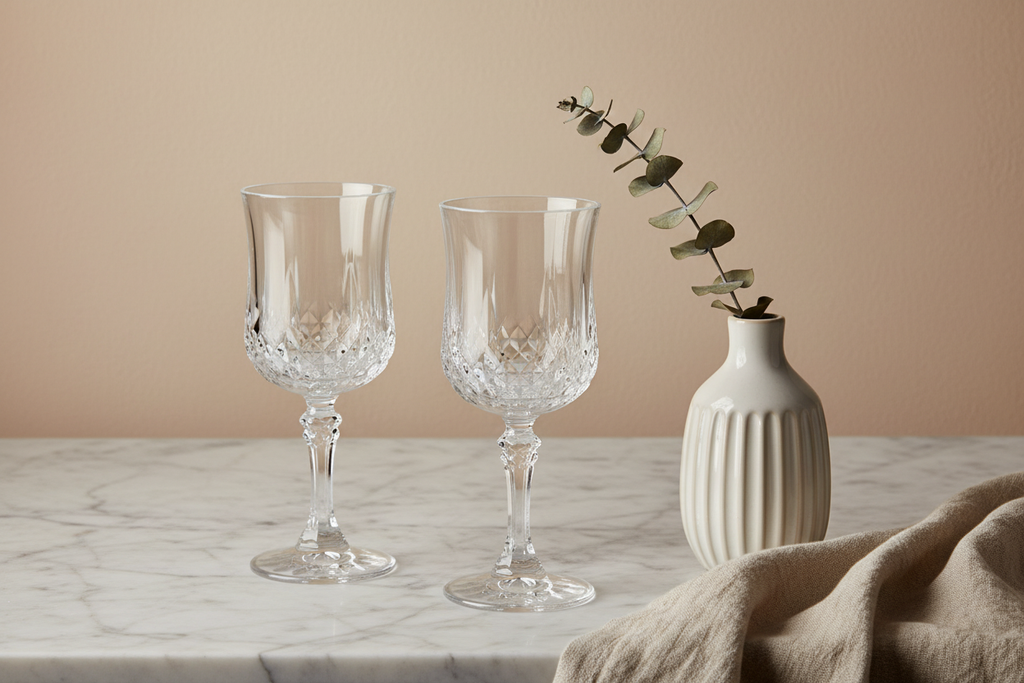 Vintage Cristal D'Arques Longchamp diamond-cut crystal wine goblets set of 2 on marble surface in elegant spa wellness setting