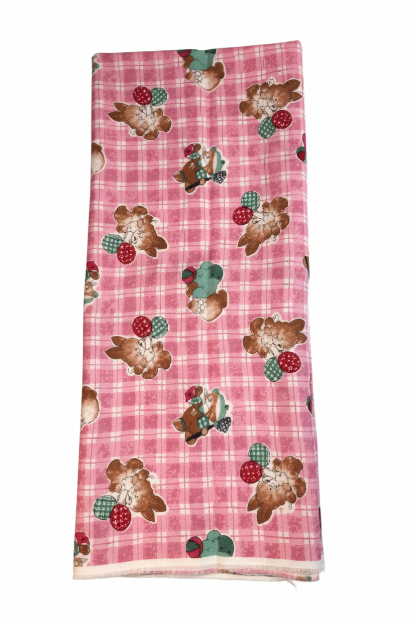 Pink plaid bunny fabric draped to show medium weight and soft texture, perfect for quilting and children's clothing