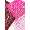 Pink, red, and white bandanas with paisley patterns on a white background