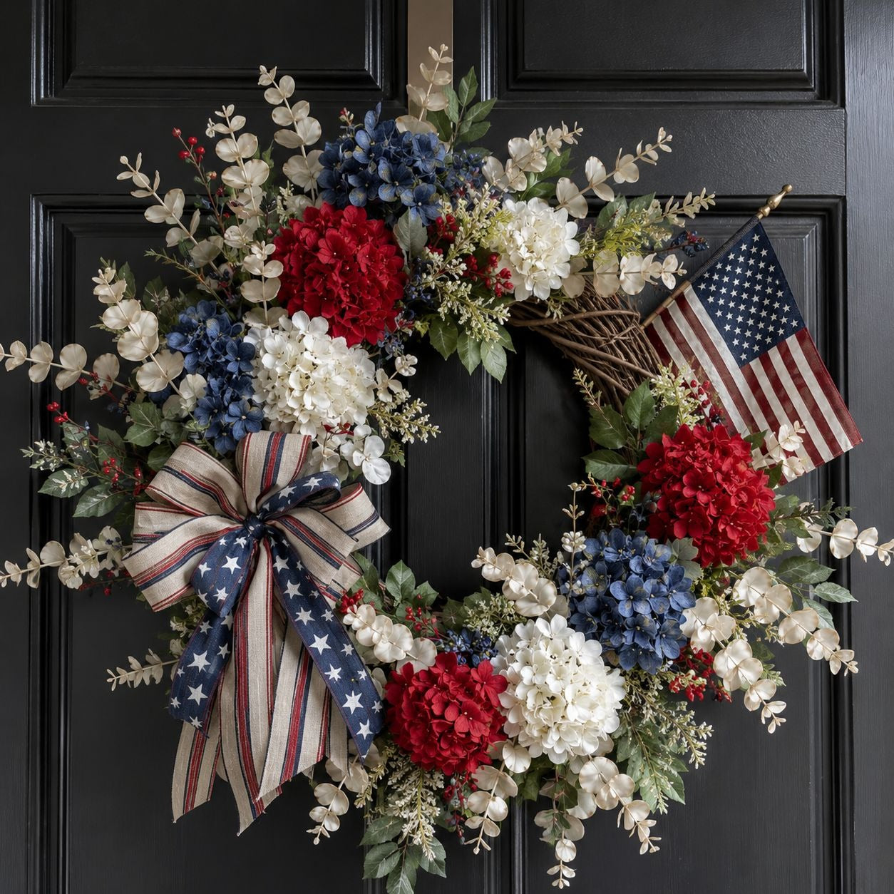 Decorative wreath with American flag and flowers on a black door