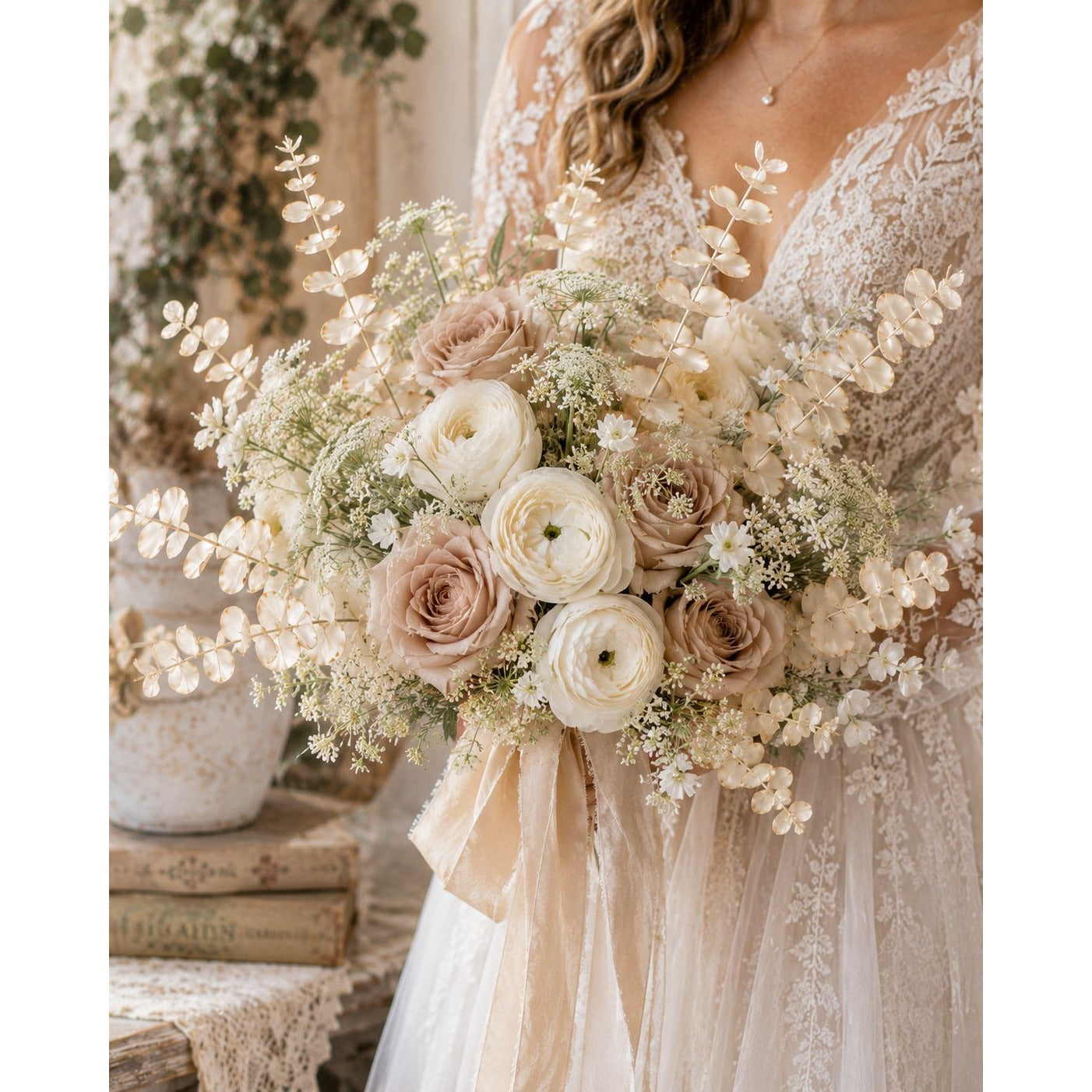 Bouquet of flowers held by a person wearing a lace dress.