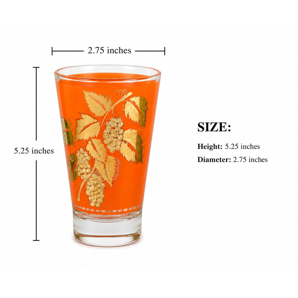 Orange glass with gold leaf design and measurements on a white background