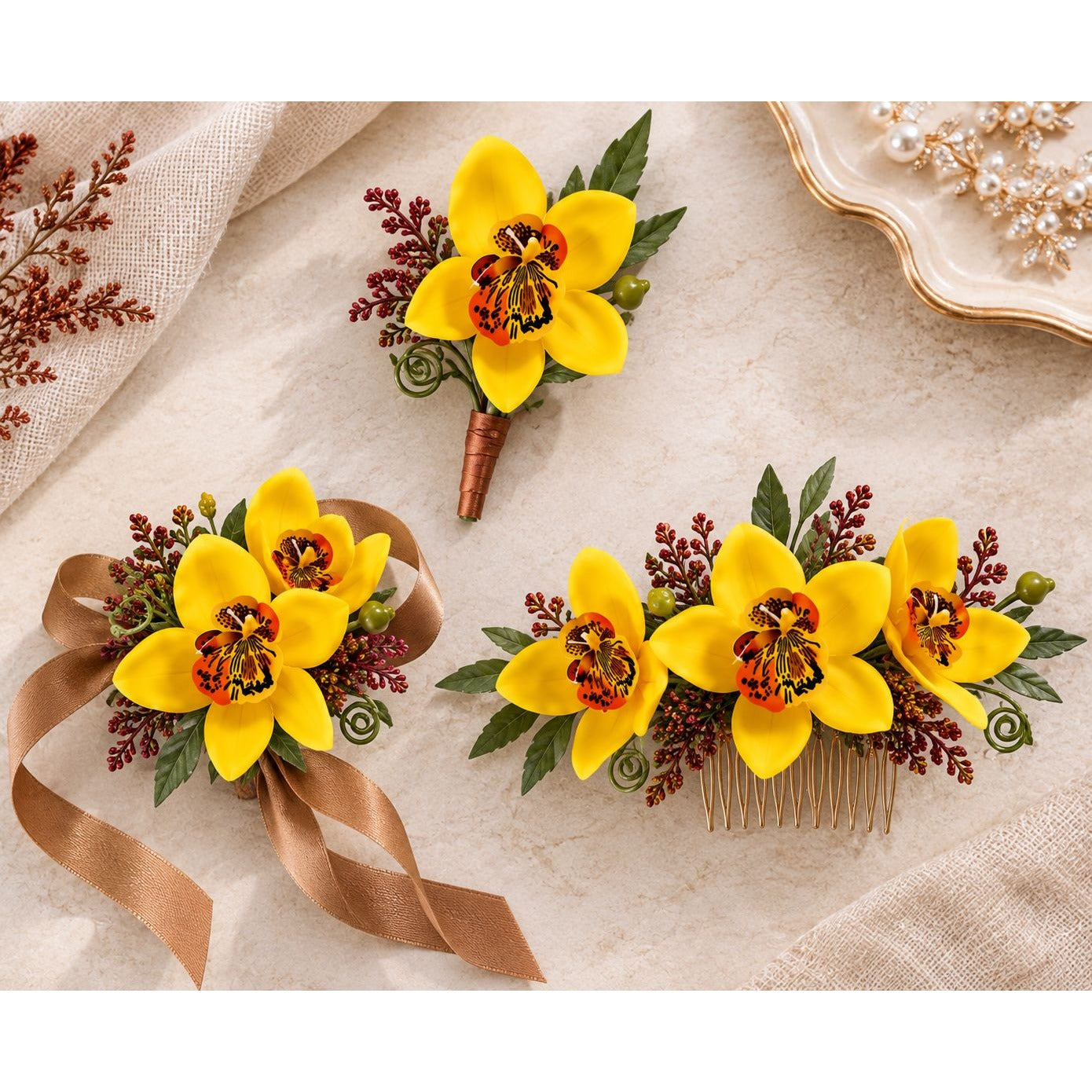 Three floral hair accessories displayed on a textured beige fabric background: a single boutonniere-style flower, a matching floral comb, and a ribboned floral hair piece. The flowers are bright yellow with dark centers, green leaves, burgundy sprigs, and brown/tan ribbons.