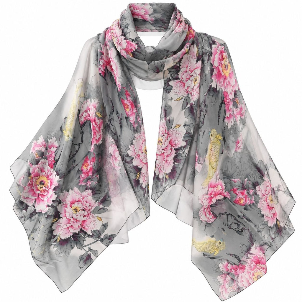 A lightweight, semi-sheer square scarf featuring a watercolor-style print of pink peonies, koi fish, and gray water scenery, draped against a solid white background.