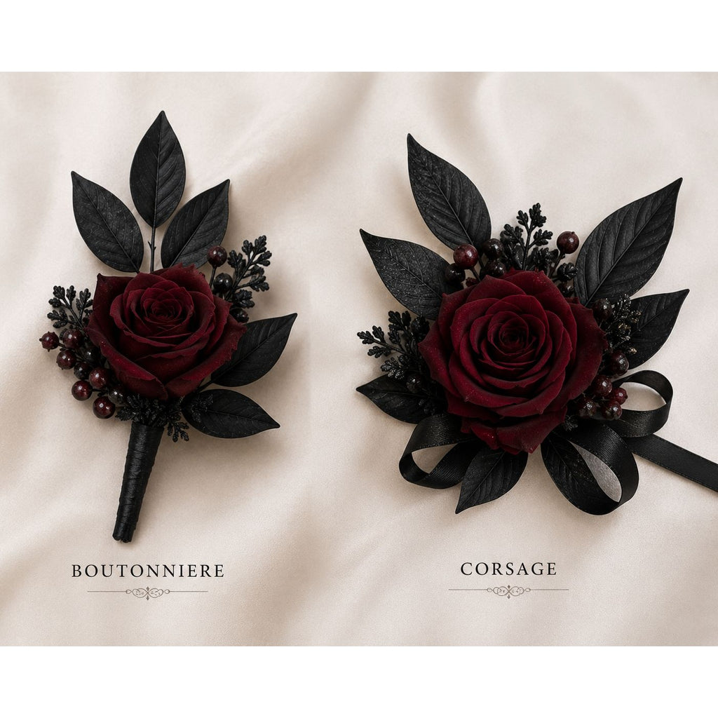 Boutonniere and corsage with dark red roses and black leaves on a light background