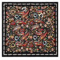 A square black satin scarf featuring an intricate paisley and floral pattern in red, gold, blue, and white, finished with a decorative white border.