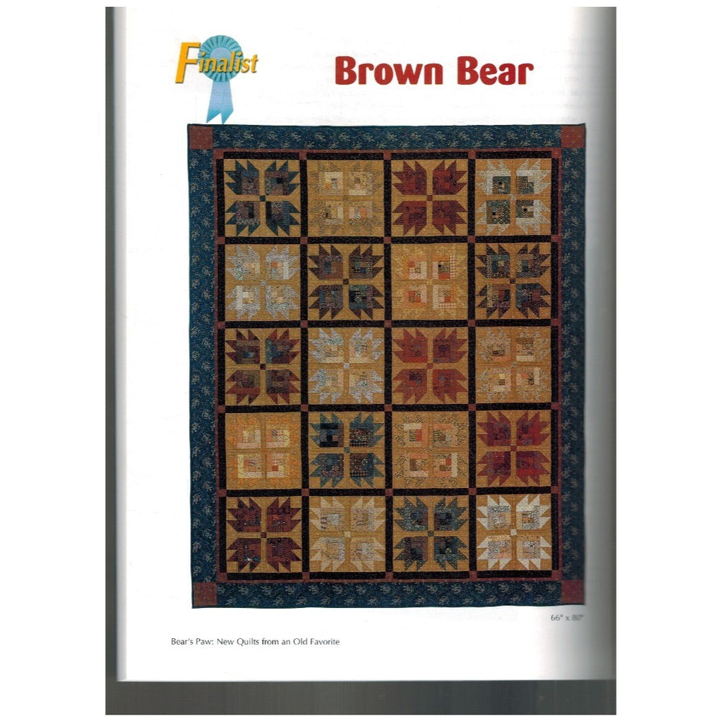Quilt with a geometric pattern titled 'Brown Bear' on a white background