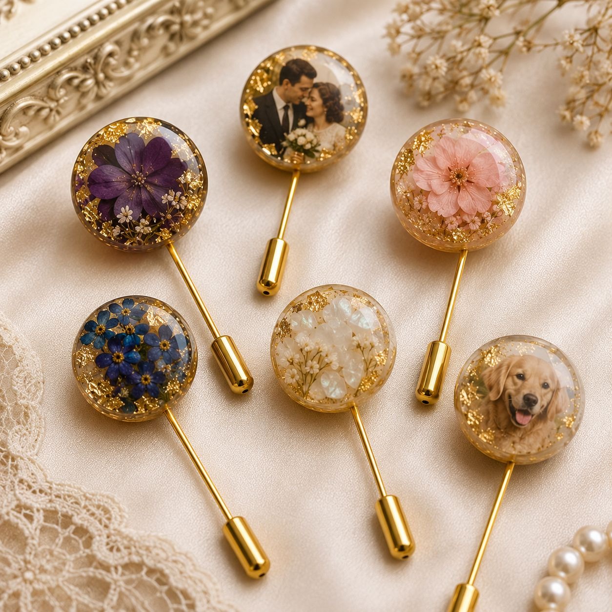 Collection of decorative lapel pins with floral and portrait designs on a textured surface.