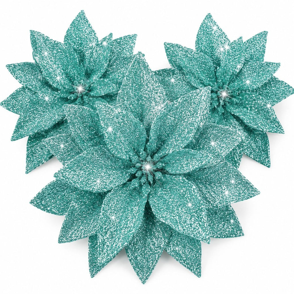 Three turquoise glittery poinsettia flowers on a white background